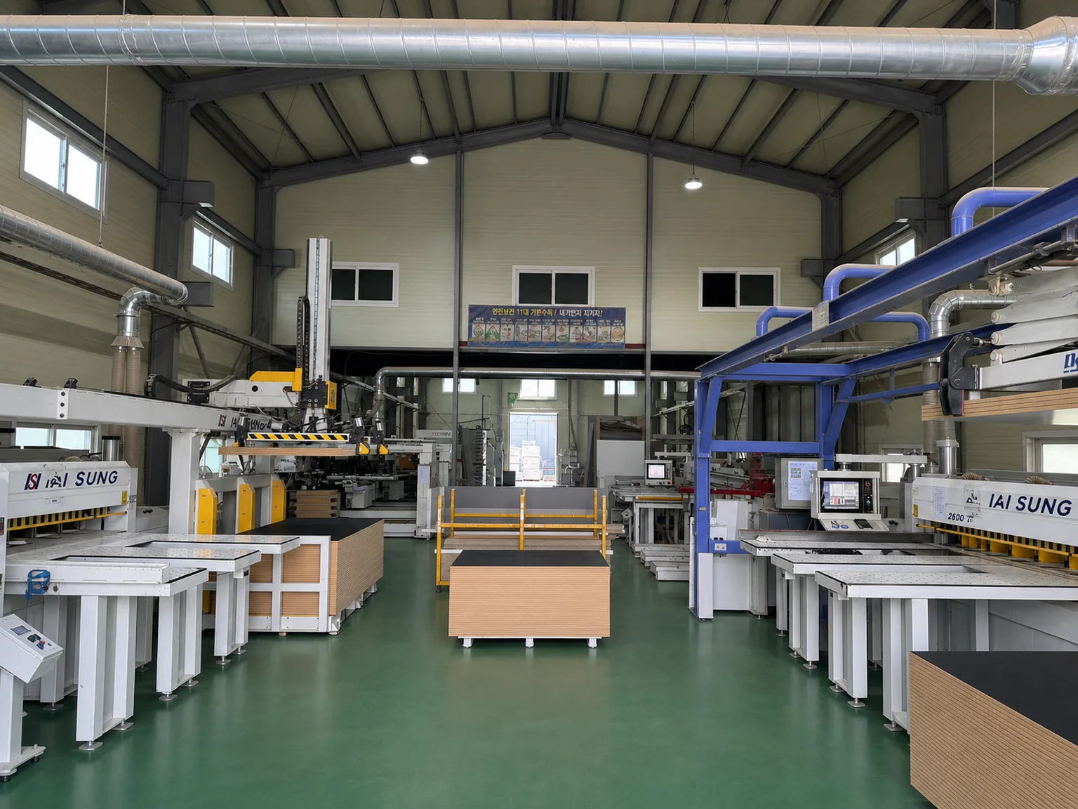 Automated production line arranged with cutting, transport, and processing equipment