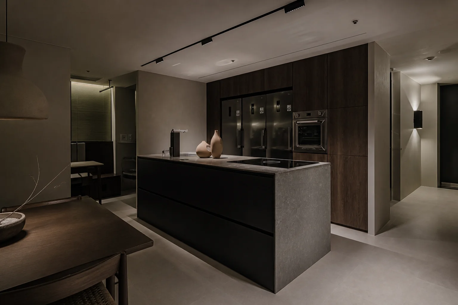 Proposed kitchen cabinetry image consisting of a dark walnut storage wall and a gray stone island